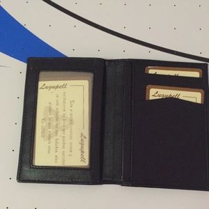 Wallet leather color black NWT scuffs yet good